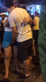 Putting her fingers under the skirt in front of the crowd