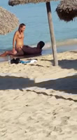 Tourist having sex on shore of the beach